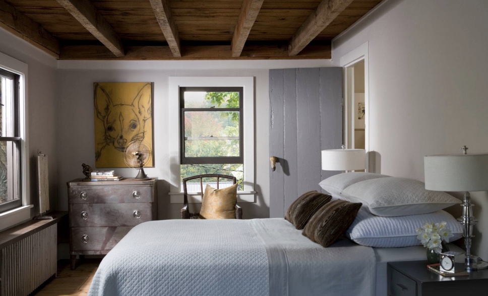 Simple room but rustic ceilings make it great.  windows in black with white trim