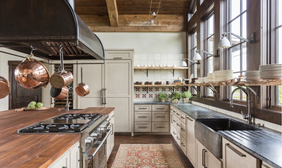 Eclectic kitchen. soapstone counters. wood work top. tile.  windows. lights. open shelves.  all is really nice
