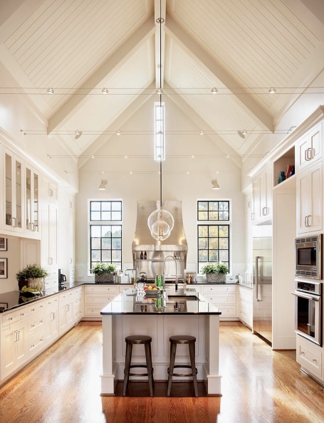 Tall ceilings. white cabs and black counters