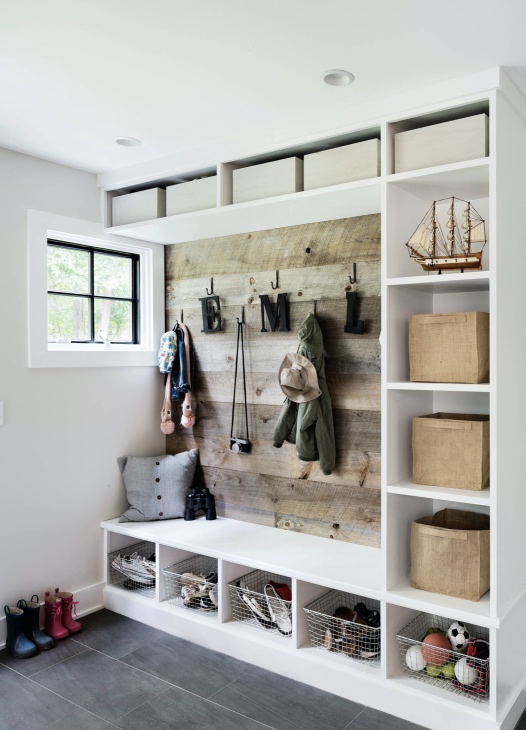 Mudroom.  utilitarian but wood wall makes it work.  upper shelves