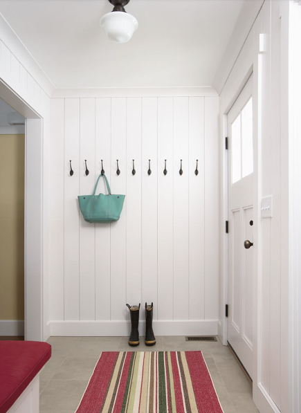 Simple hooks on a textural white wall